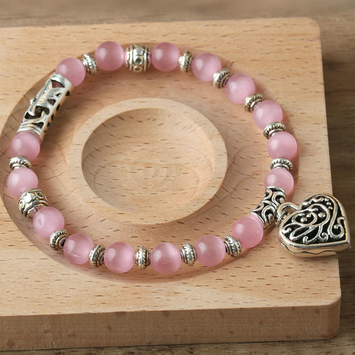 Bracelet œil de chat rose avec pendentif Hollow Love Olivenorma