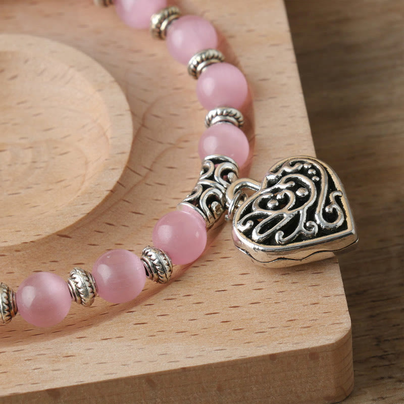 Bracelet œil de chat rose avec pendentif Hollow Love Olivenorma