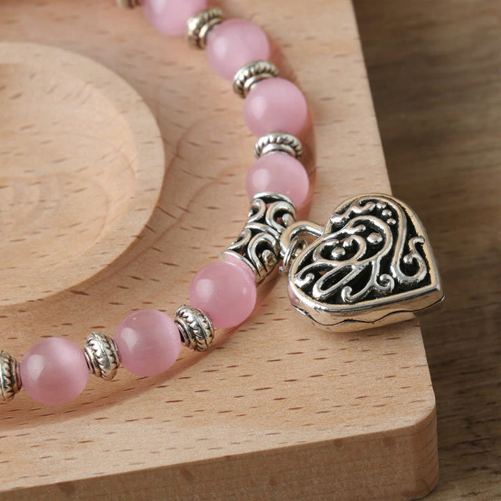 Bracelet œil de chat rose avec pendentif Hollow Love Olivenorma