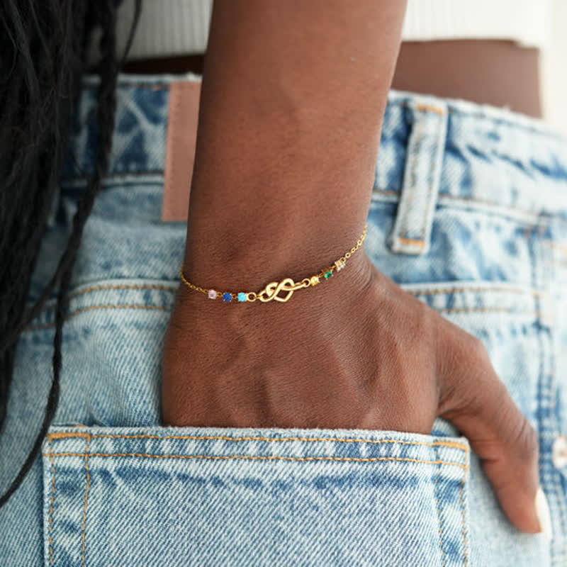 Bracelet personnalisé Olivenorma avec 1 à 8 pierres de naissance et nœud en forme de cœur