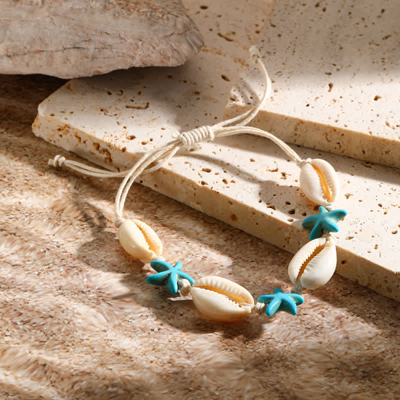 Bracelet de plage avec pendentif tortue étoile de mer turquoise blanche Olivenorma