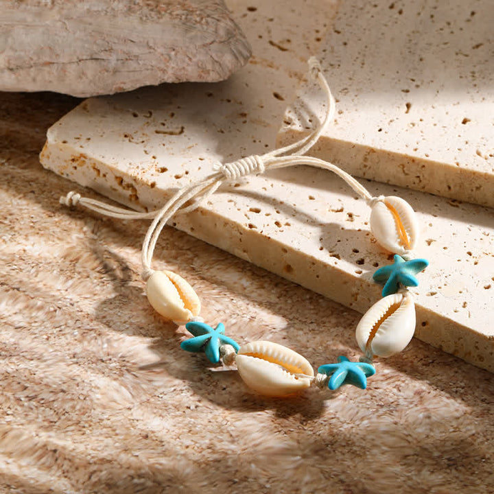 Bracelet de plage avec pendentif tortue étoile de mer turquoise blanche Olivenorma