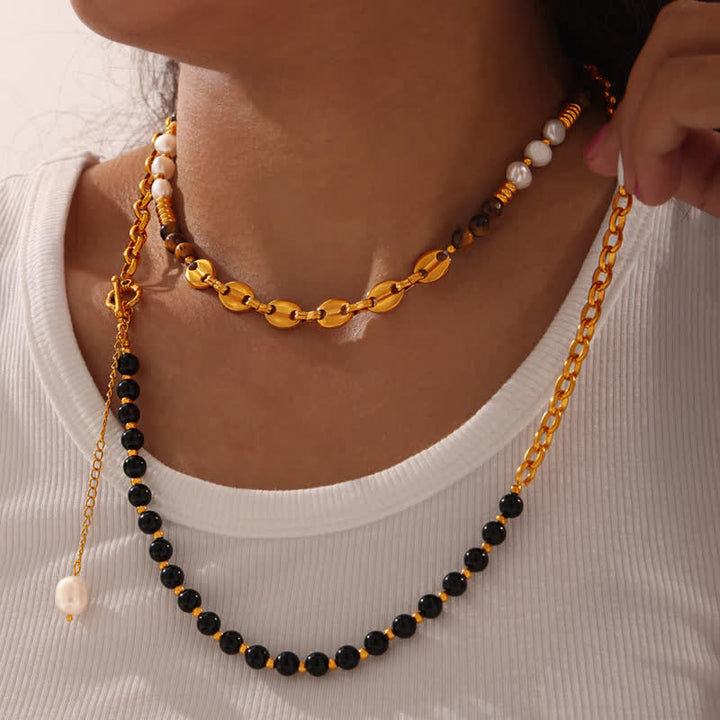 Collier en acier titane et perles d'eau douce en obsidienne œil de tigre Olivenorma 