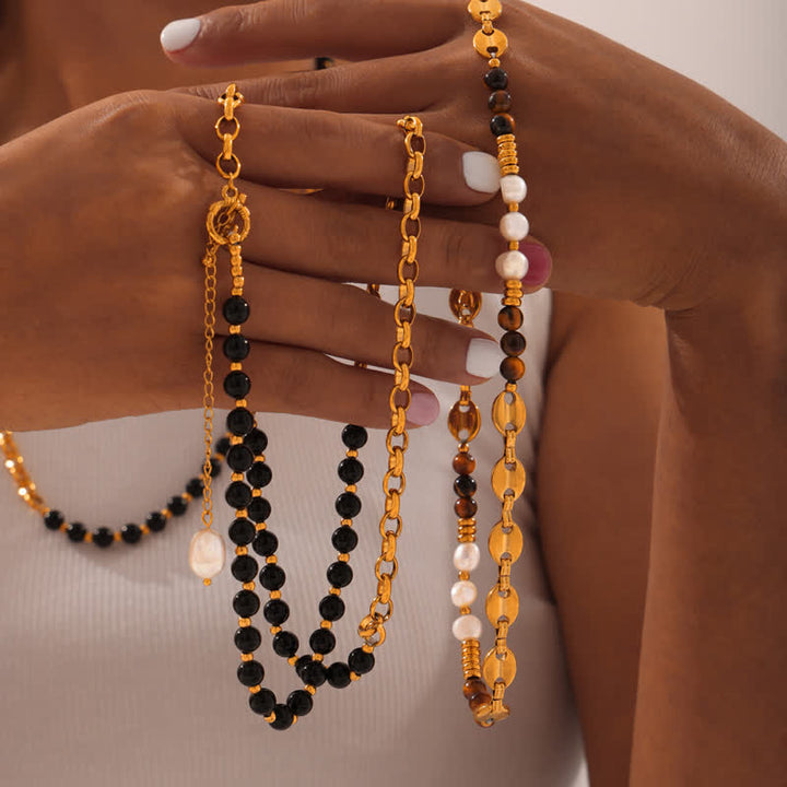 Collier en acier titane et perles d'eau douce en obsidienne œil de tigre Olivenorma 