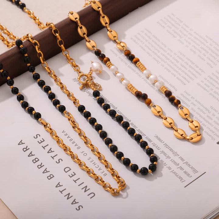 Collier en acier titane et perles d'eau douce en obsidienne œil de tigre Olivenorma 