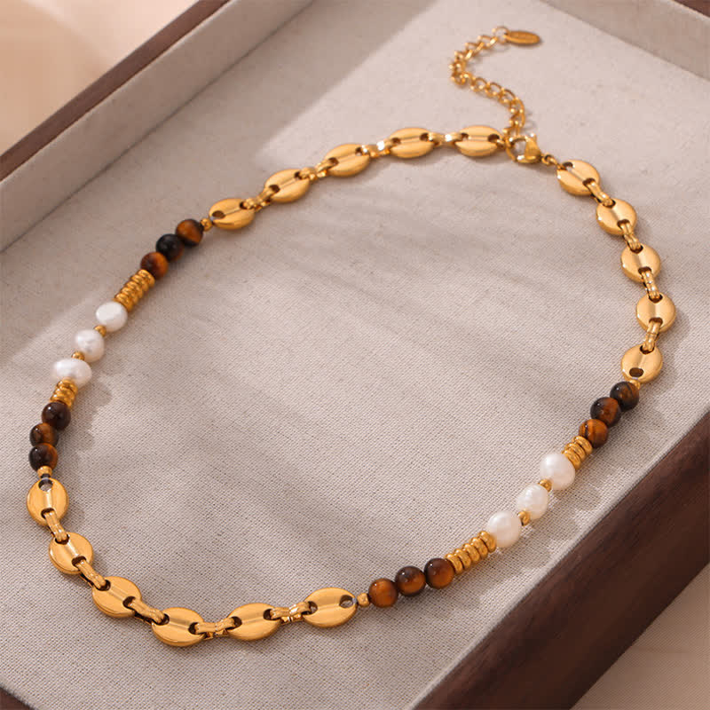 Collier en acier titane et perles d'eau douce en obsidienne œil de tigre Olivenorma 