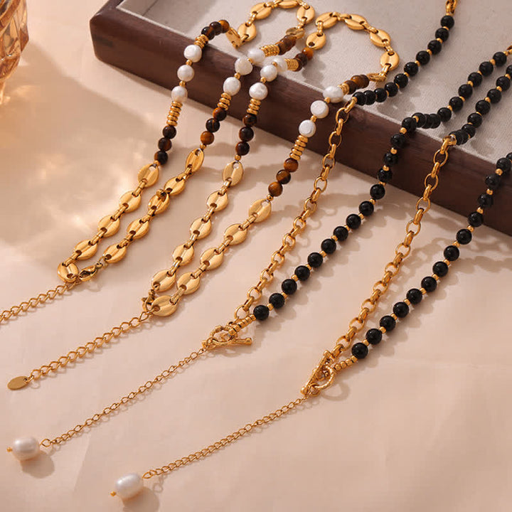 Collier en acier titane et perles d'eau douce en obsidienne œil de tigre Olivenorma 