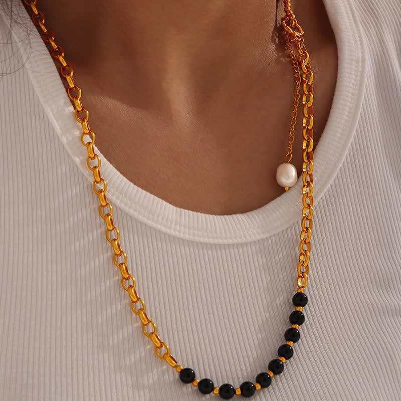 Collier en acier titane et perles d'eau douce en obsidienne œil de tigre Olivenorma 