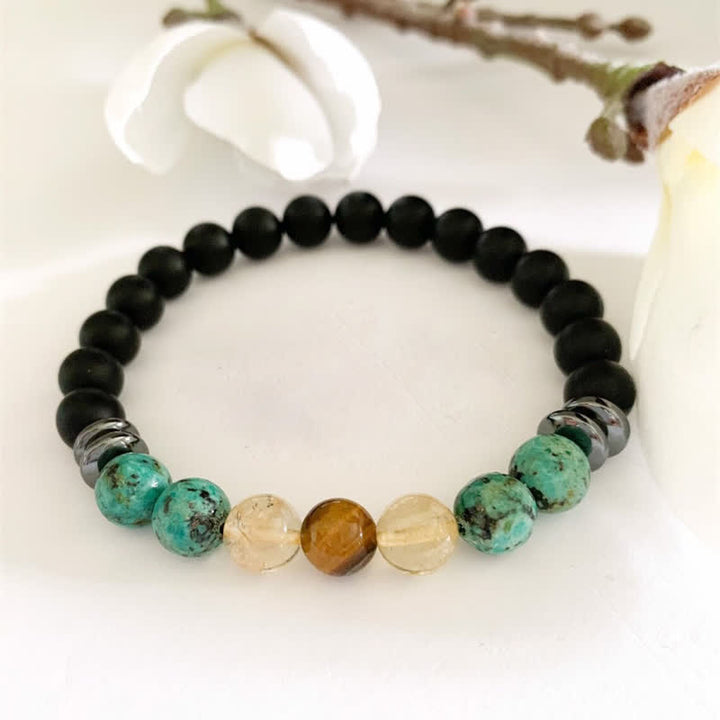 Bracelet en perles de pierre de lave turquoise africaine Olivenorma 