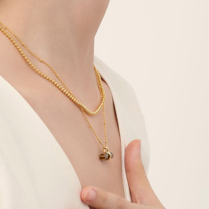Collier pendentif en bois équilibrant en œil de tigre naturel Olivenorma
