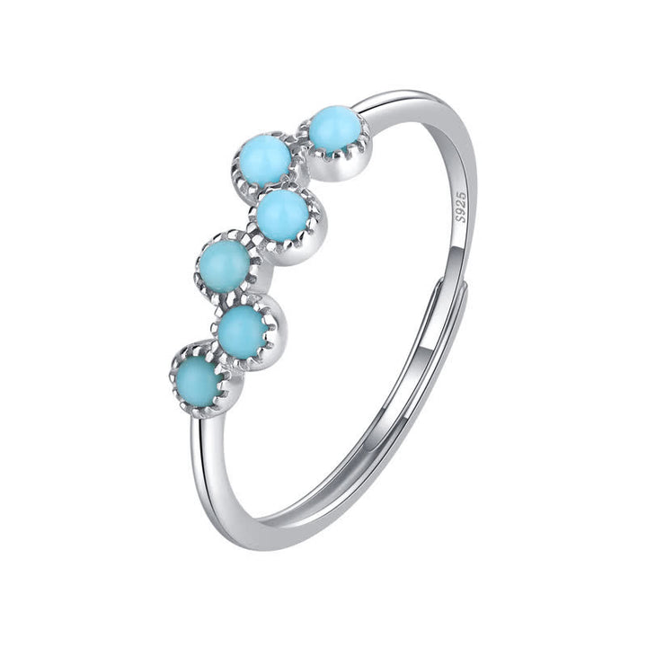 Bague de couple créative ronde à quatre griffes en turquoise Olivenorma