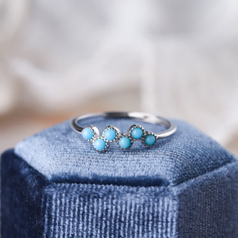 Bague de couple créative ronde à quatre griffes en turquoise Olivenorma