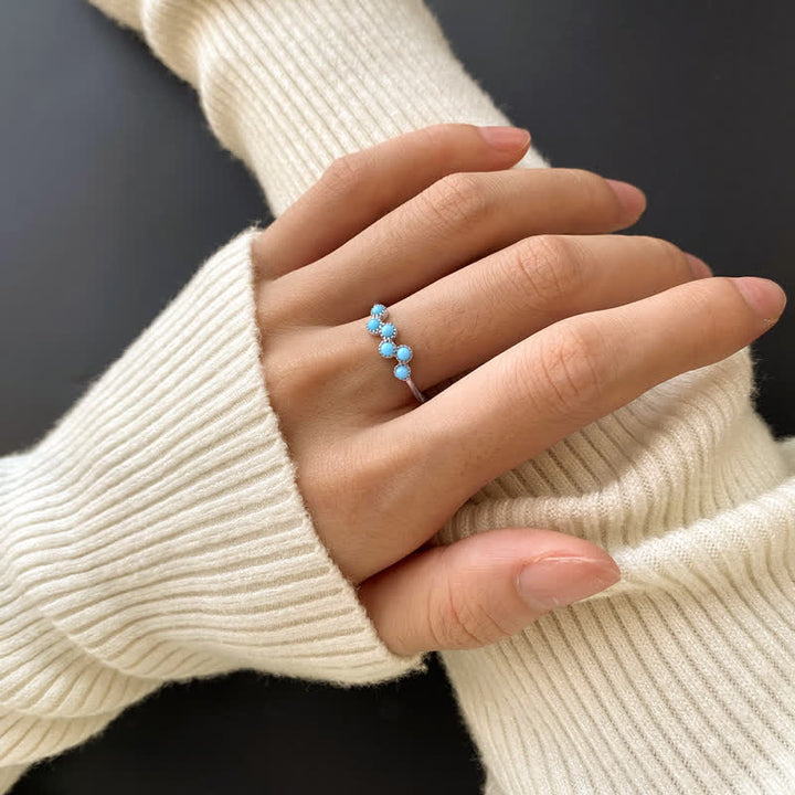 Bague de couple créative ronde à quatre griffes en turquoise Olivenorma