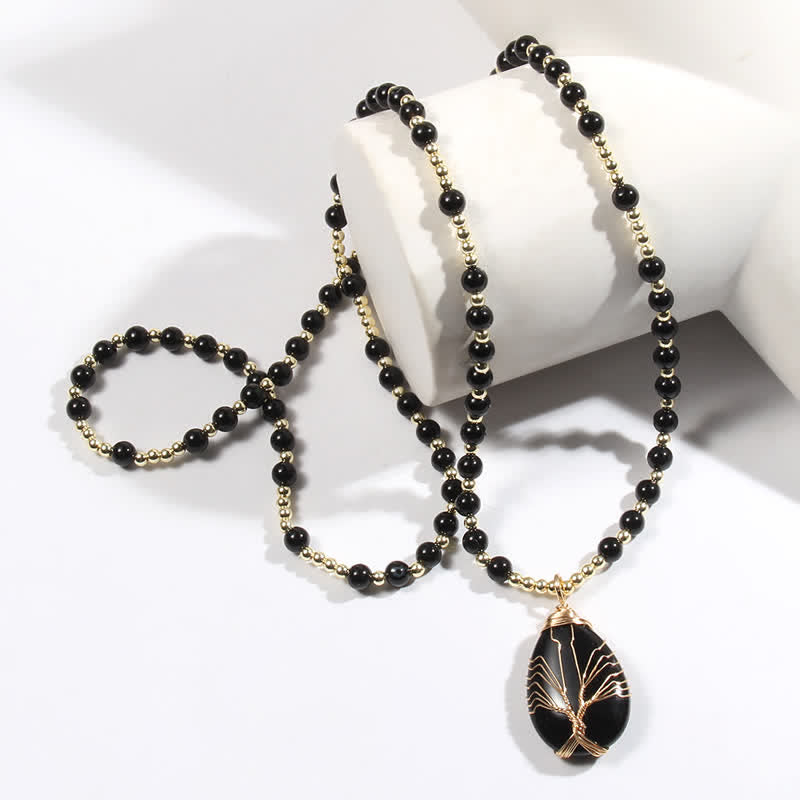 Collier avec pendentif en forme de goutte d'arbre de vie en perles de pierre Olivenorma