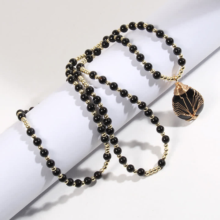 Collier avec pendentif en forme de goutte d'arbre de vie en perles de pierre Olivenorma