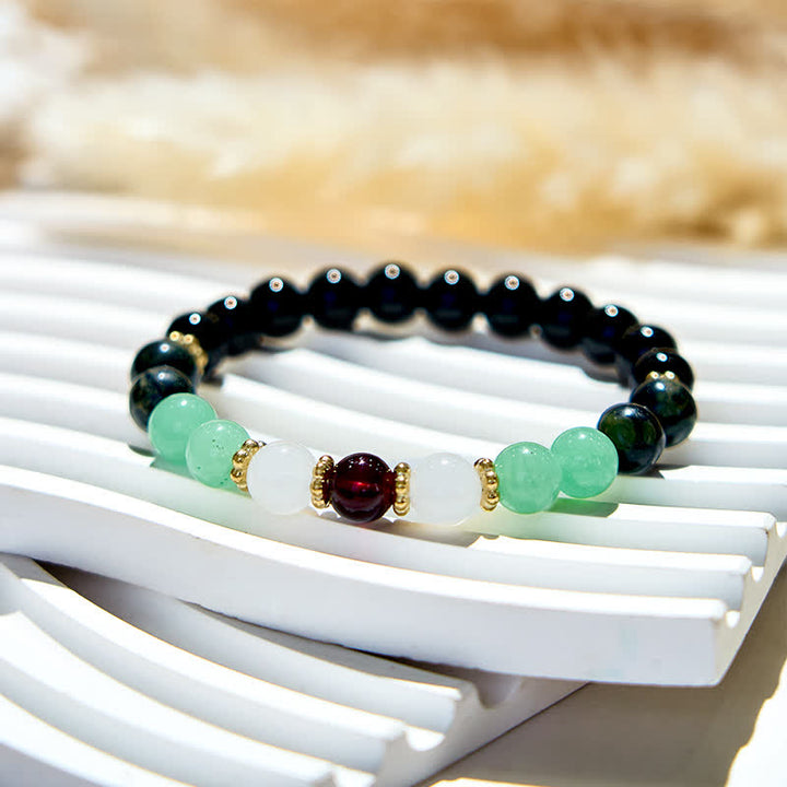 Bracelet en perles d'obsidienne et de grenat naturel Olivenorma