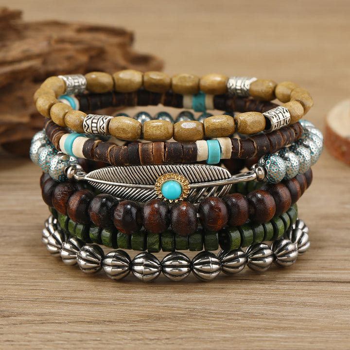 Ensemble de bracelets en perles de bois et plumes turquoise Olivenorma