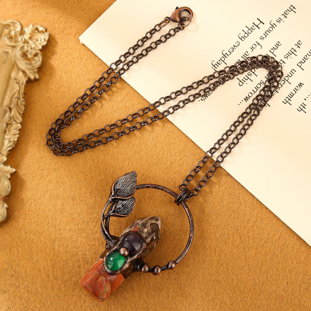 Collier avec pendentif en forme de balle en pierre naturelle Olivenorma