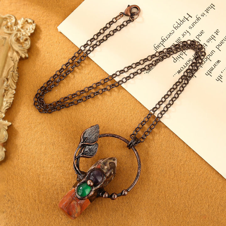 Collier avec pendentif en forme de balle en pierre naturelle Olivenorma