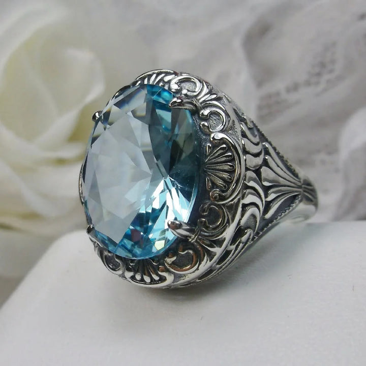 Bague rétro Olivenorma avec pierre précieuse sculptée à facettes aigue-marine