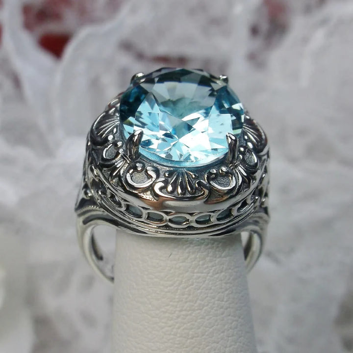 Bague rétro Olivenorma avec pierre précieuse sculptée à facettes aigue-marine