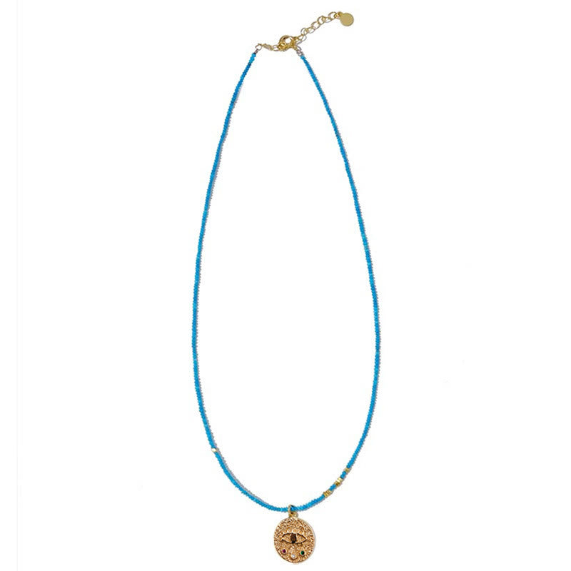 Collier de perles turquoise avec breloque mauvais œil Olivenorma