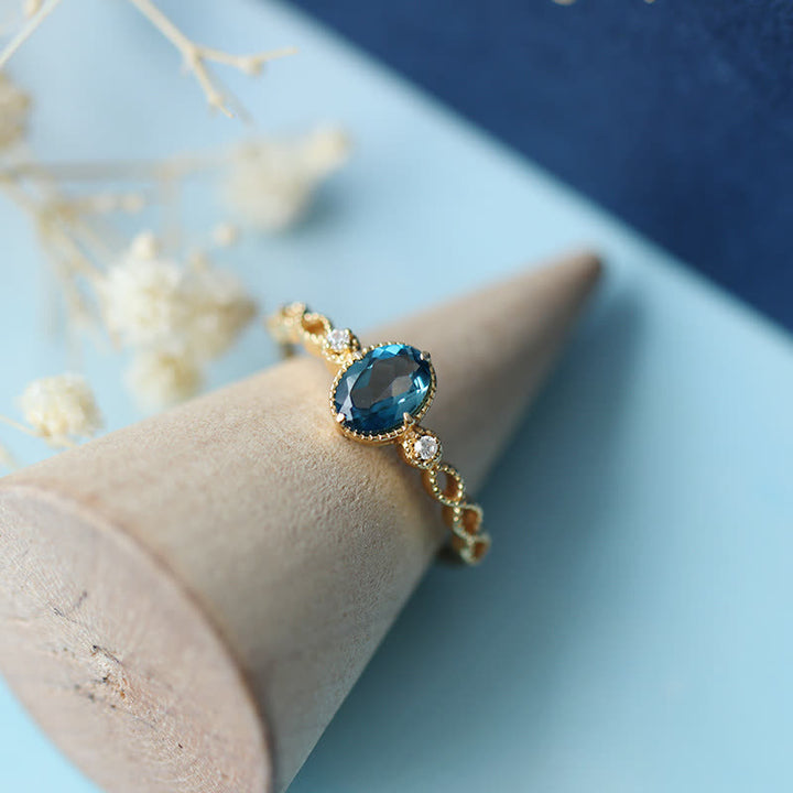 Bague olivenorma vintage avec topaze bleue ovale