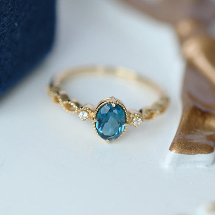 Bague olivenorma vintage avec topaze bleue ovale