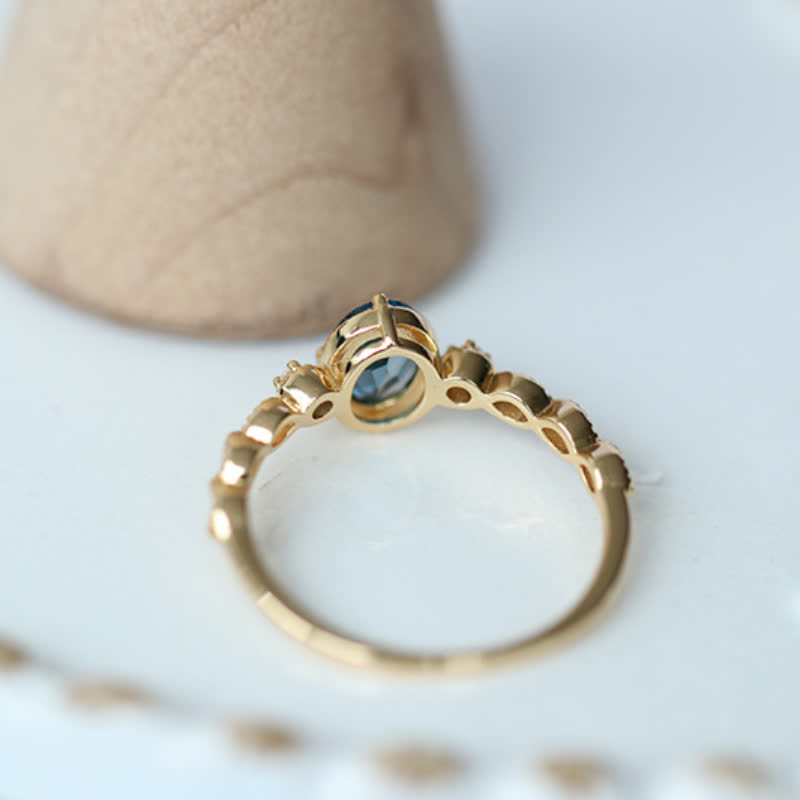 Bague olivenorma vintage avec topaze bleue ovale