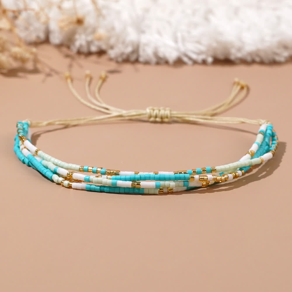 Bracelet de plage tressé en perles de riz bleu et blanc Olivenorma