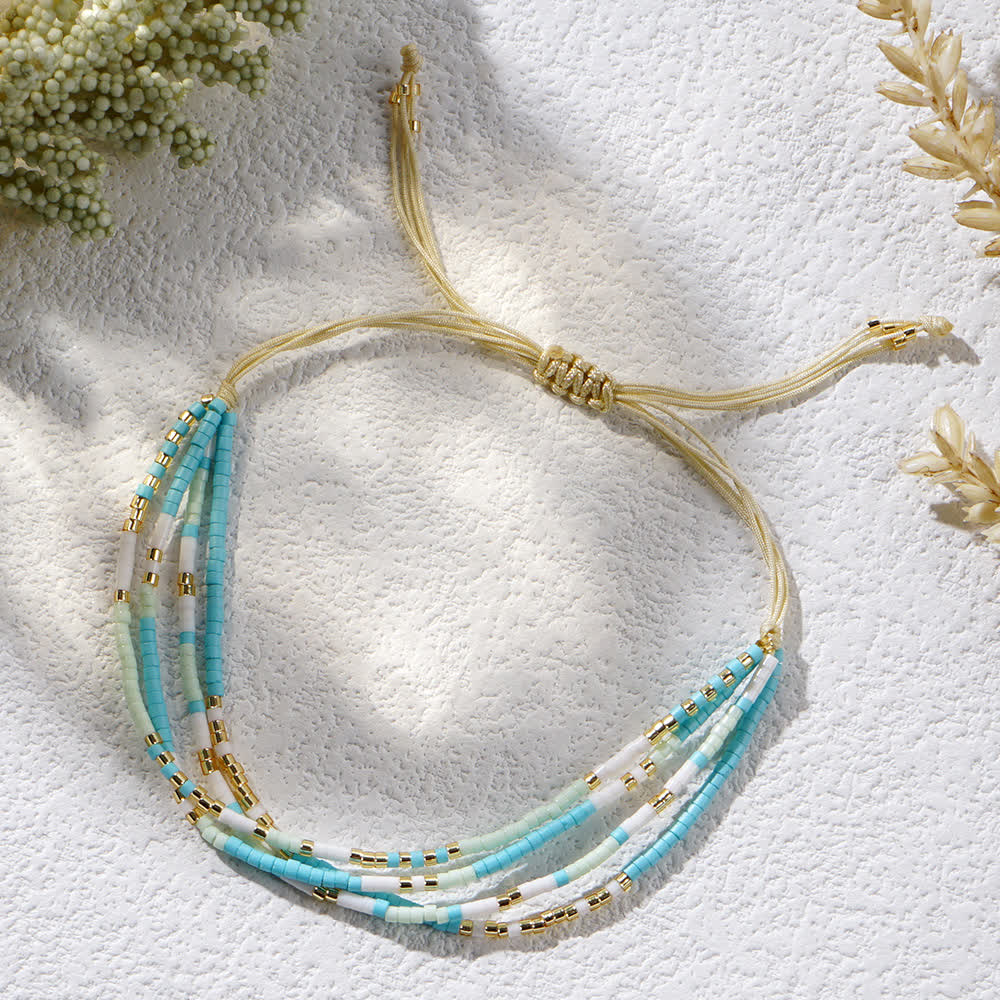 Bracelet de plage tressé en perles de riz bleu et blanc Olivenorma