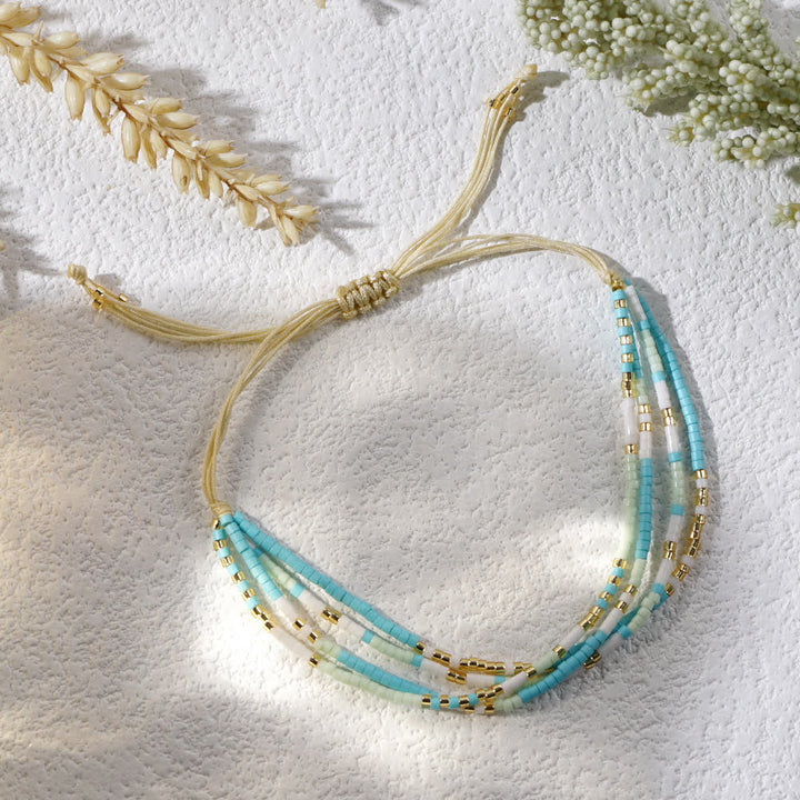 Bracelet de plage tressé en perles de riz bleu et blanc Olivenorma
