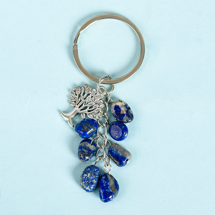 Porte-clés en pierre naturelle brute Olivenorma avec arbre de vie