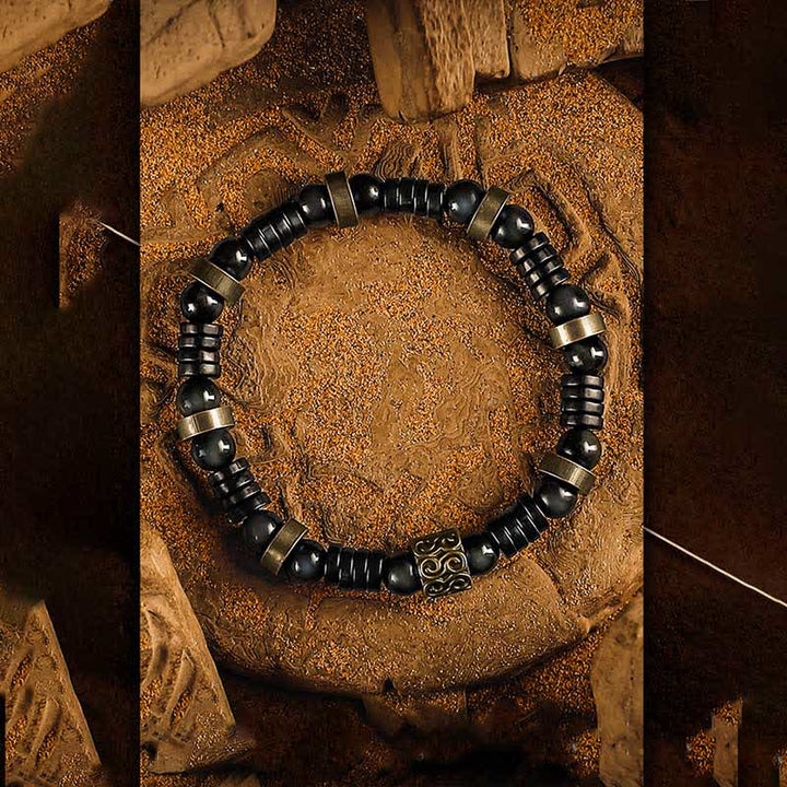 Bracelet en perles de noix de coco en obsidienne argentée Olivenorma