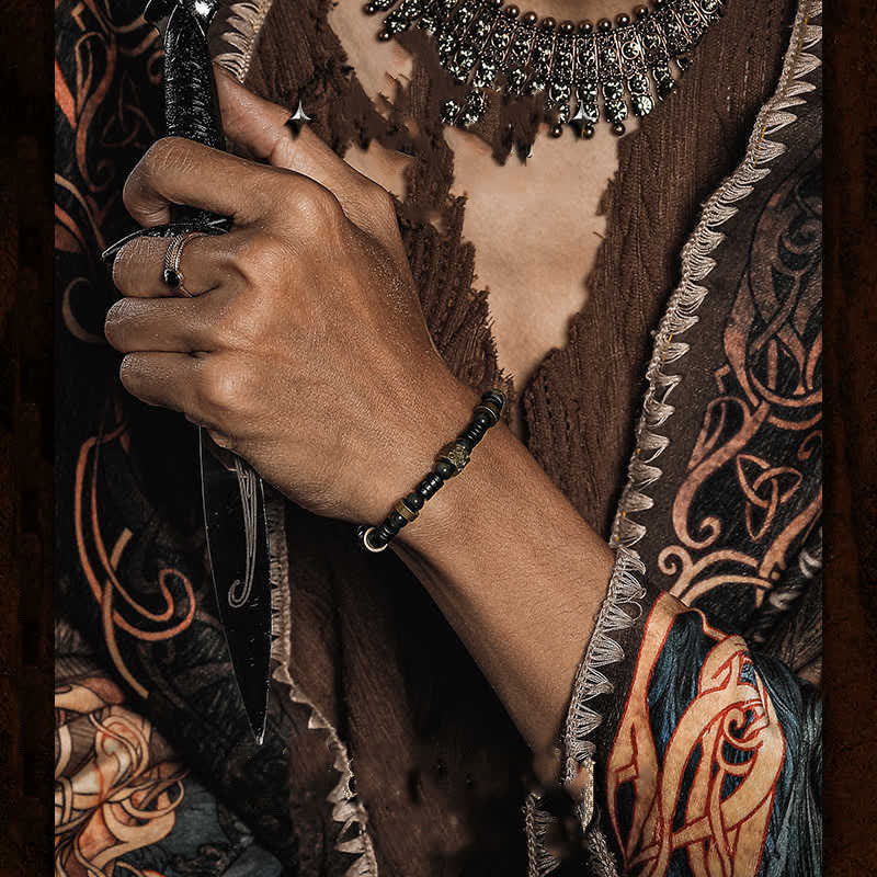 Bracelet en perles de noix de coco en obsidienne argentée Olivenorma