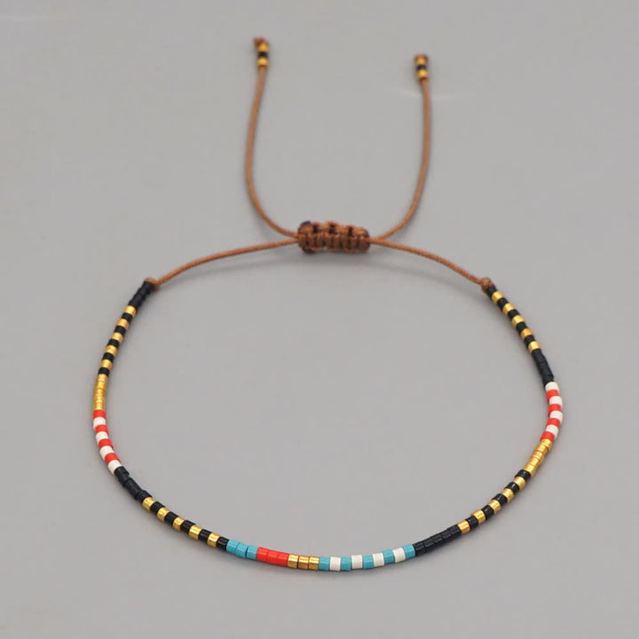 Bracelet tressé marron en perles de riz colorées Olivenorma