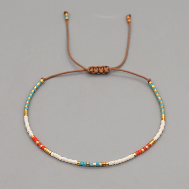 Bracelet tressé marron en perles de riz colorées Olivenorma
