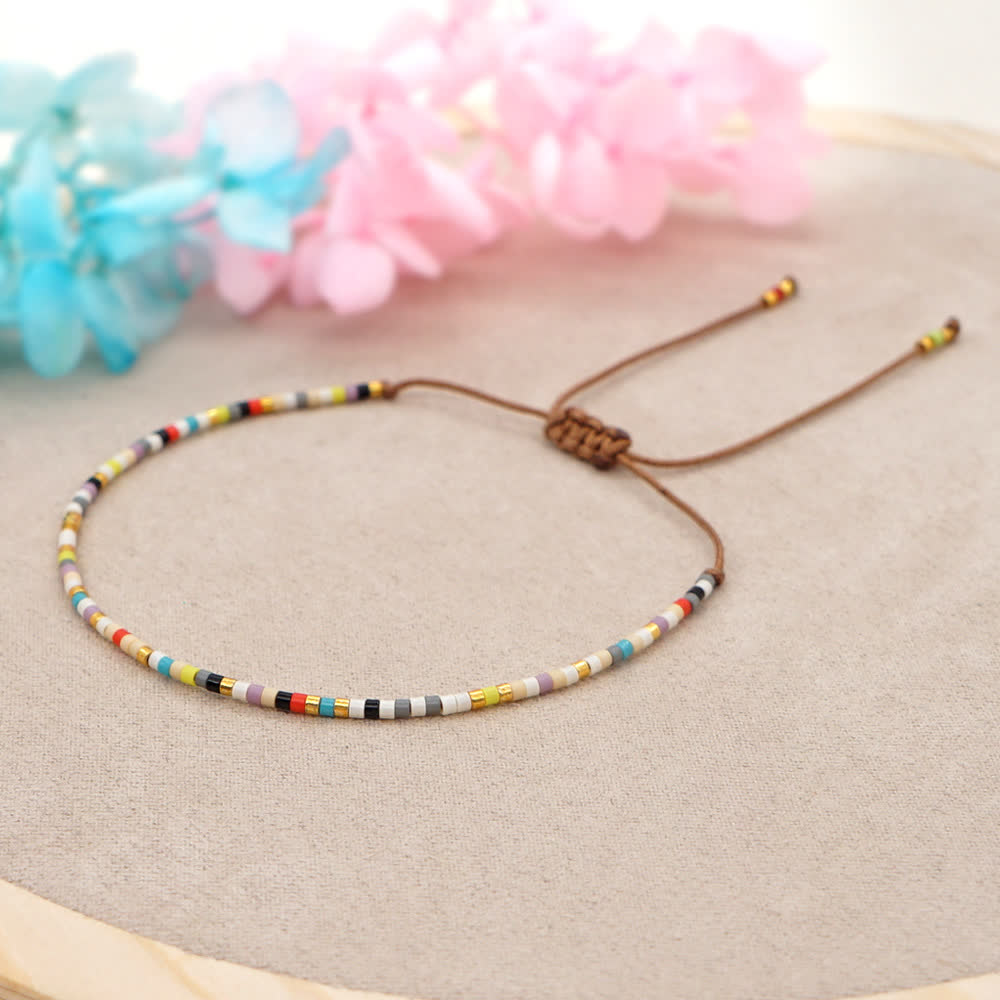 Bracelet tressé marron en perles de riz colorées Olivenorma
