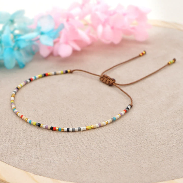 Bracelet tressé marron en perles de riz colorées Olivenorma