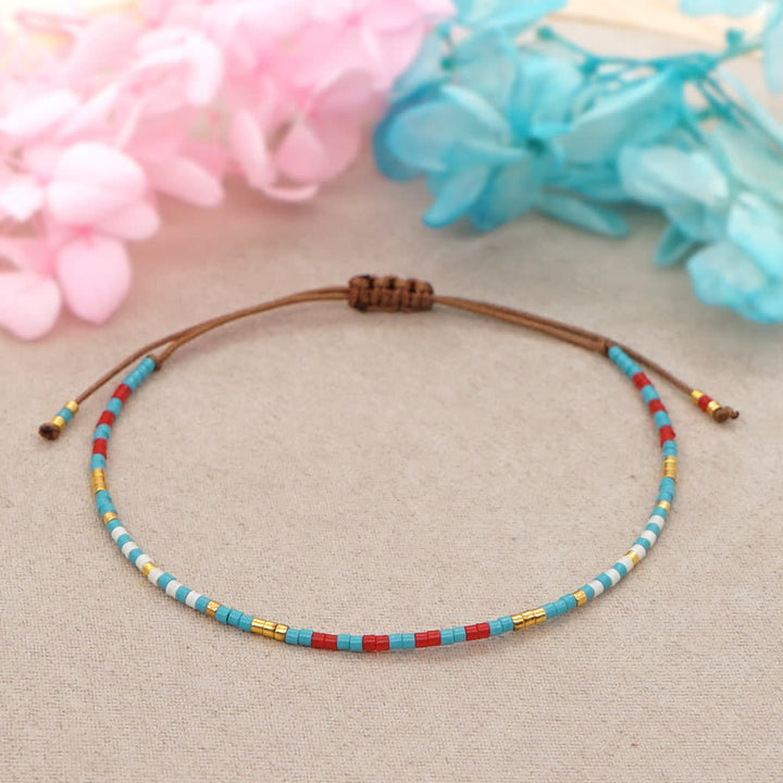 Bracelet tressé marron en perles de riz colorées Olivenorma