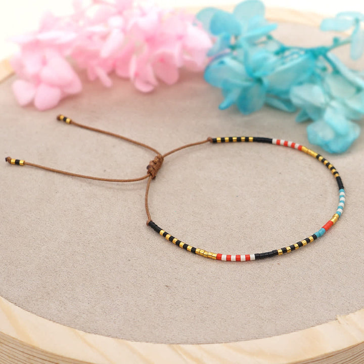 Bracelet tressé marron en perles de riz colorées Olivenorma