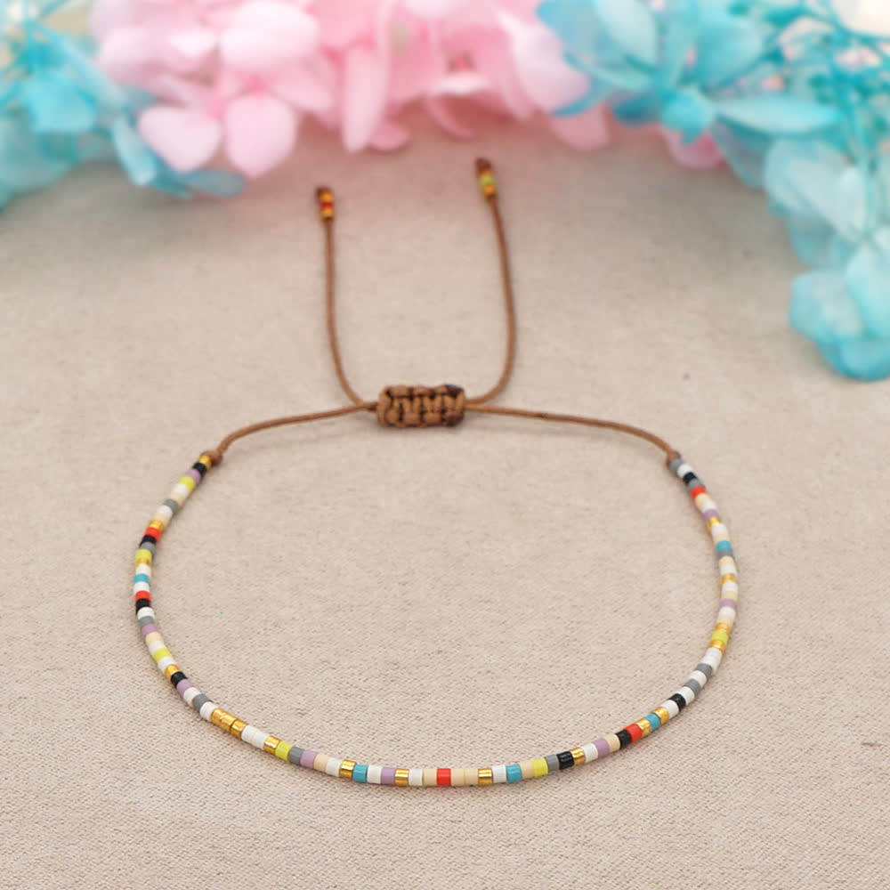 Bracelet tressé marron en perles de riz colorées Olivenorma