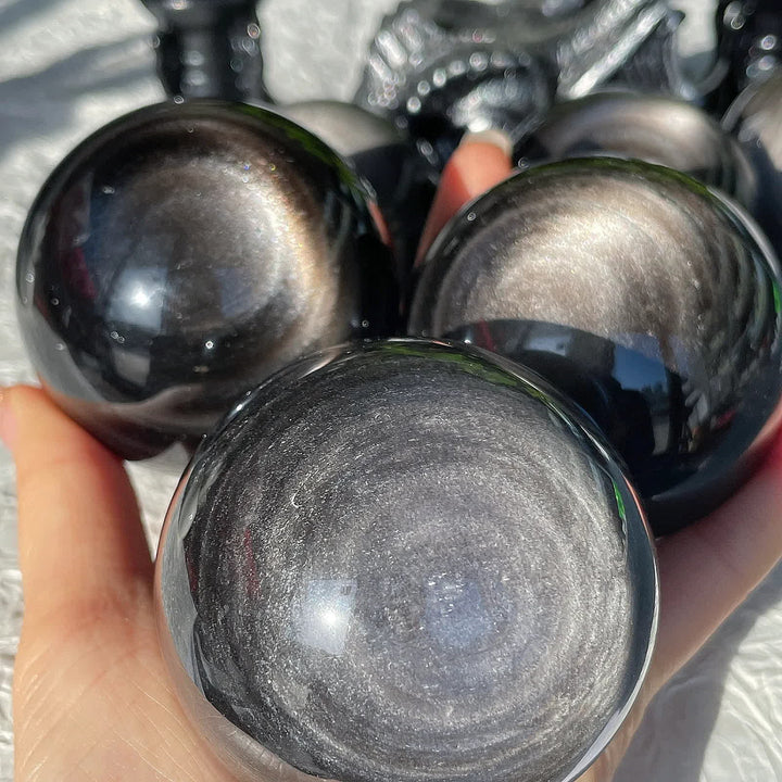 Sphère de cristal d'obsidienne argentée naturelle Olivenorma