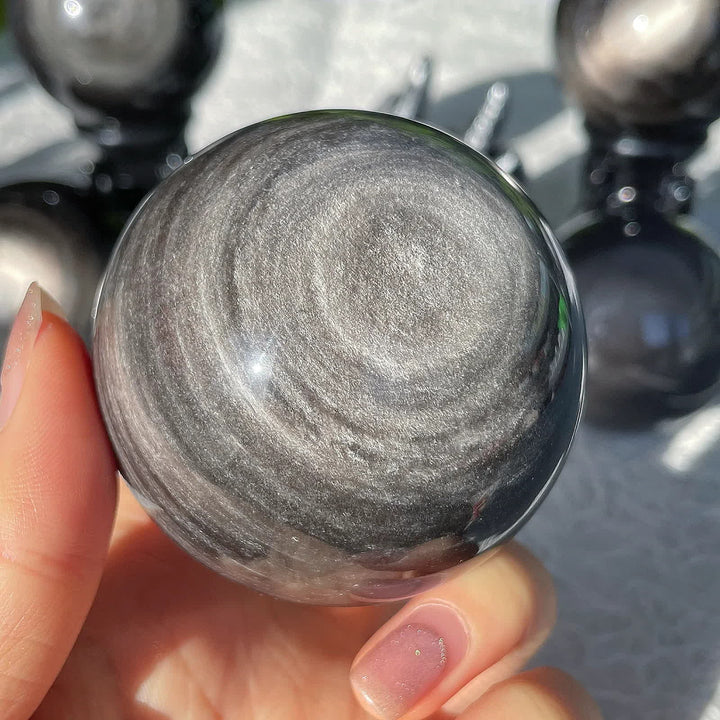 Sphère de cristal d'obsidienne argentée naturelle Olivenorma