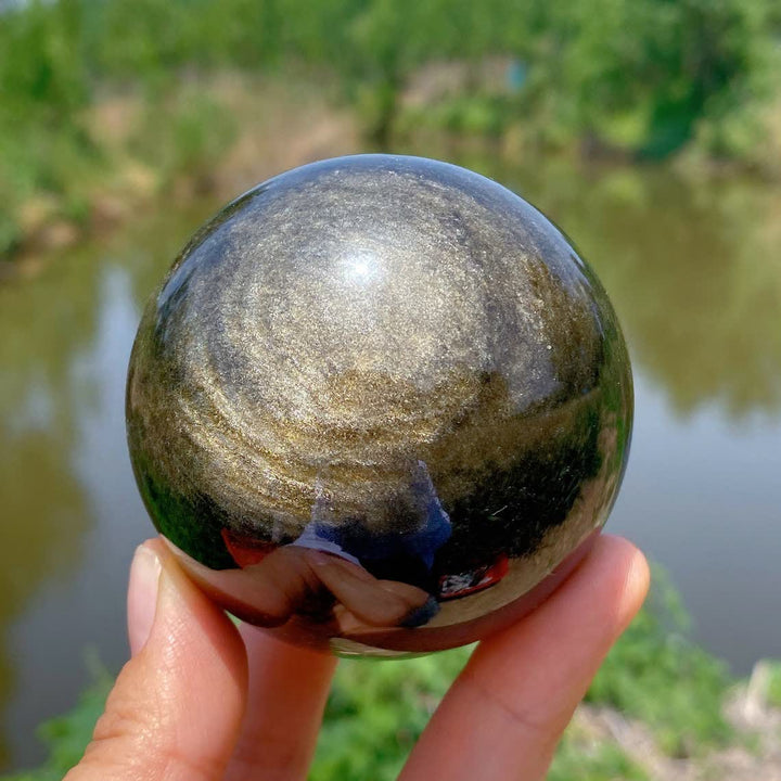Sphère de cristal d'obsidienne dorée naturelle Olivenorma