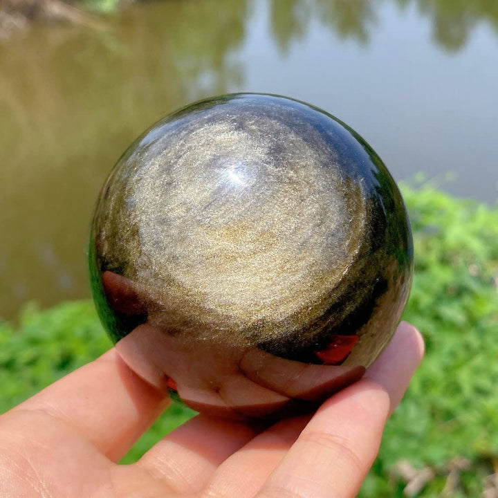 Sphère de cristal d'obsidienne dorée naturelle Olivenorma