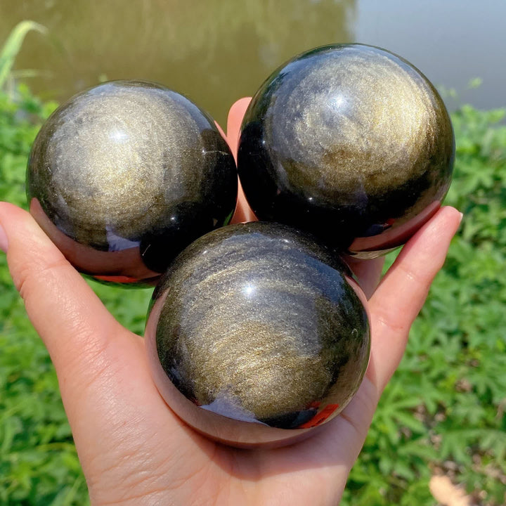 Sphère de cristal d'obsidienne dorée naturelle Olivenorma