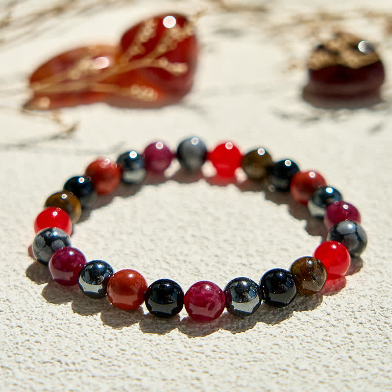 Bracelet de perles en obsidienne flocon de neige, hématite, rubis et quartz Olivenorma