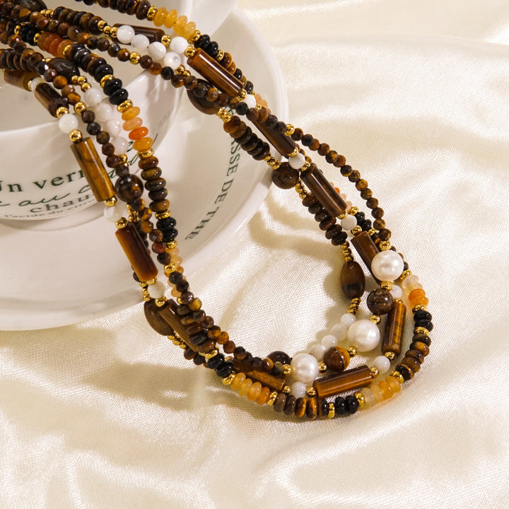 Collier de perles en obsidienne et œil de tigre en calcédoine blanche Olivenorma