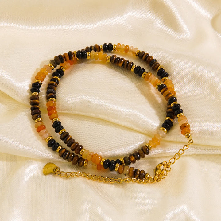 Collier de perles en obsidienne et œil de tigre en calcédoine blanche Olivenorma